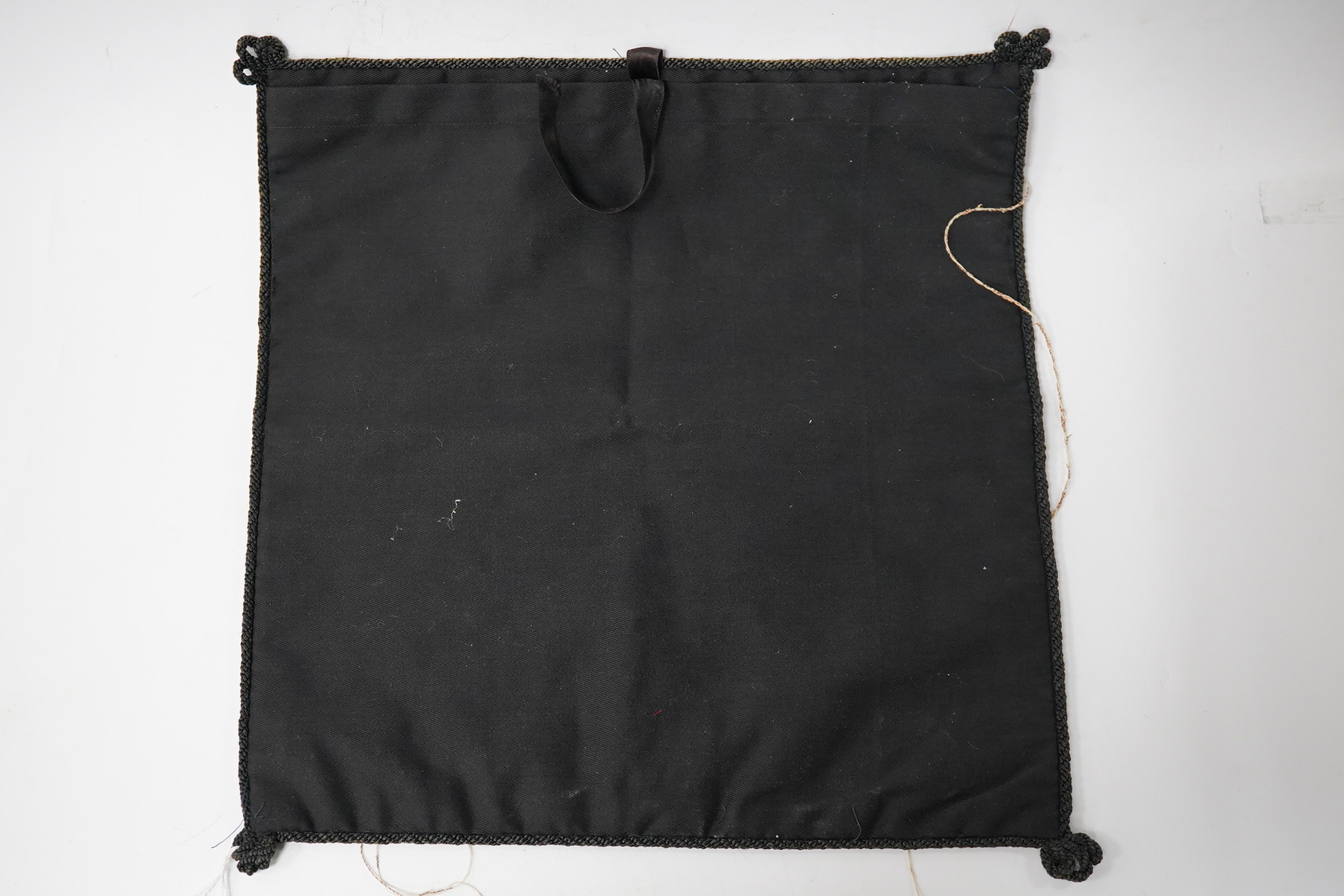 A Chinese 20th century silk embroidered Phoenix rank badge with border. 25cm x 26cm. Condition - embroidery worn in places with some loose threads. Possibly restorable